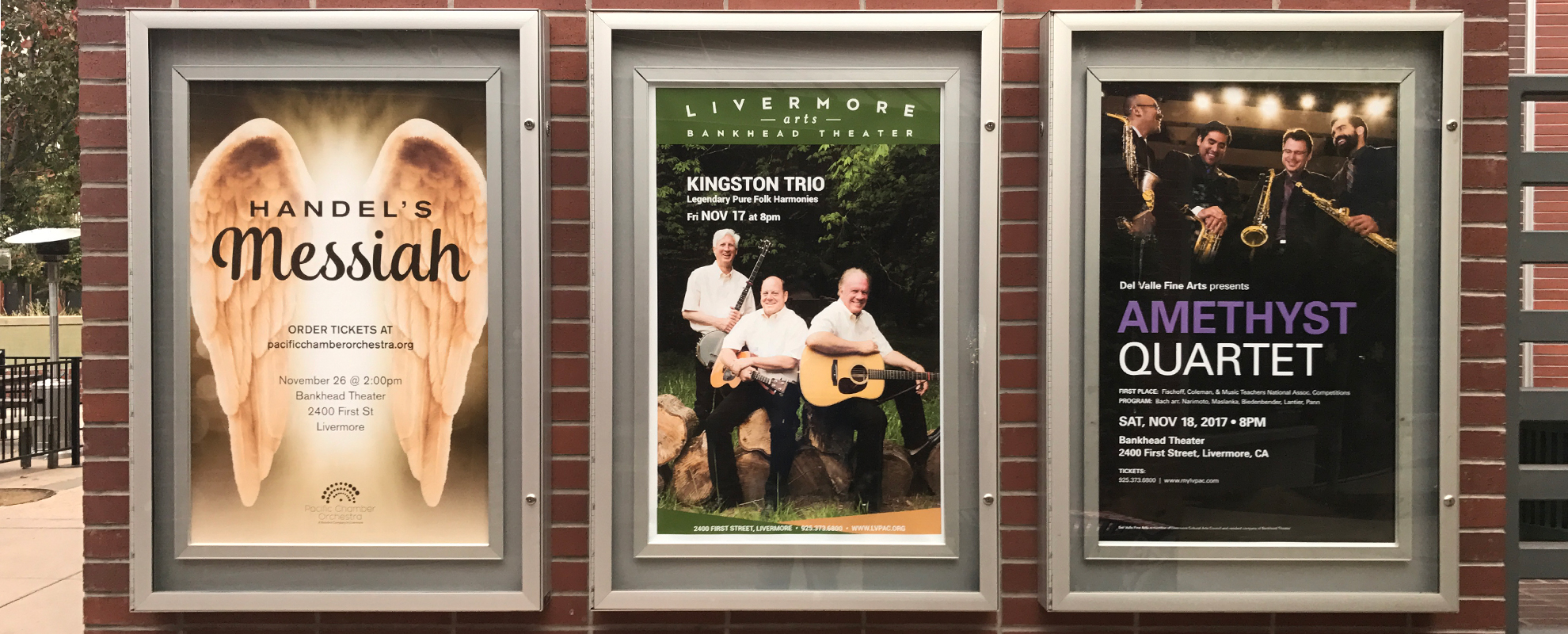 Digital posters on a wall at Livermore Performing Arts Center.