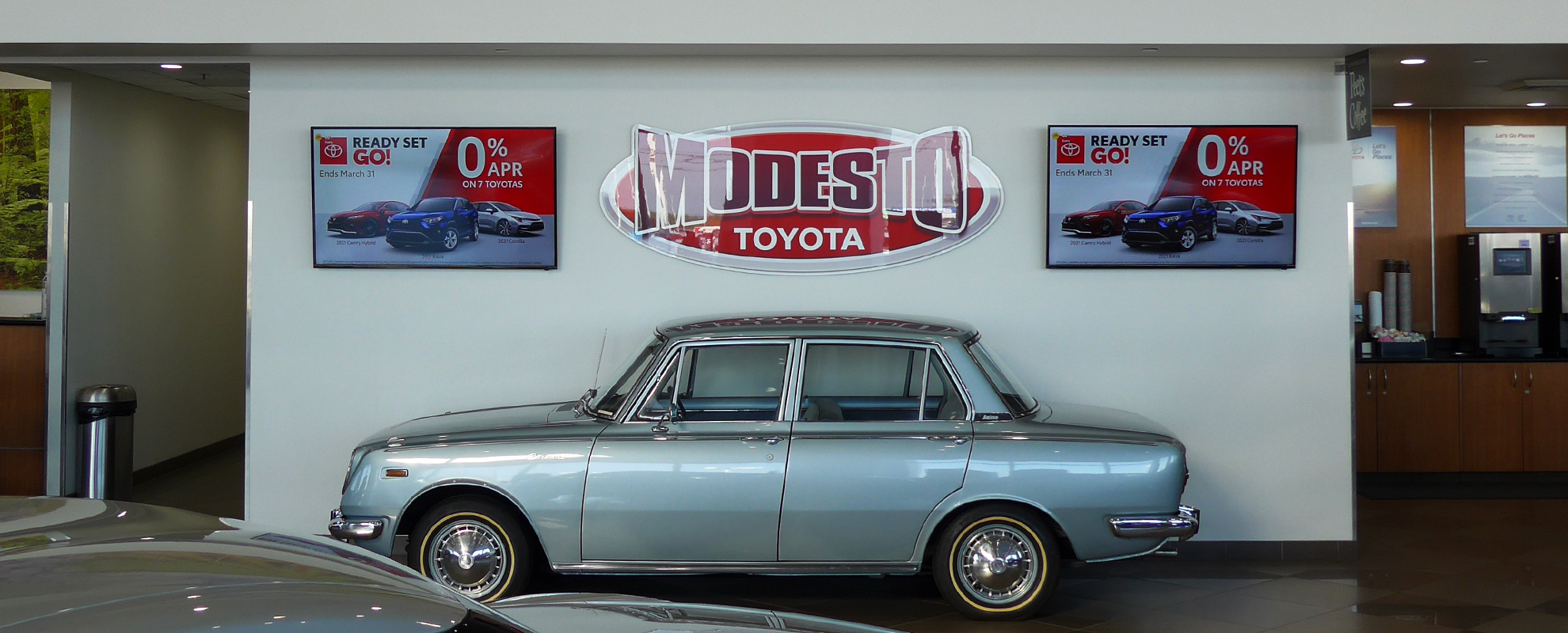 Welcome sign on a digital display at the entrance of Modesto Toyota.